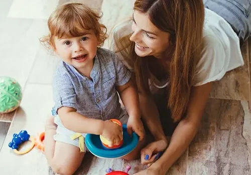 Mom child playing with toys | Canales Flooring