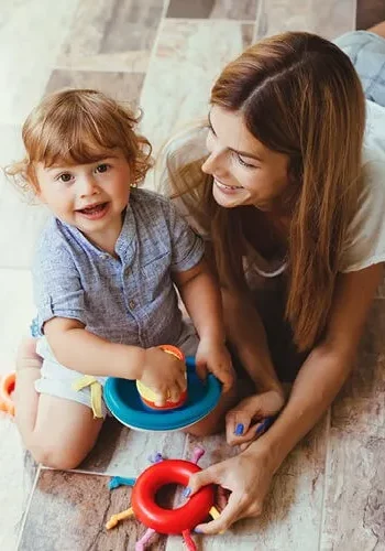 Mom child playing with toys | Canales Flooring